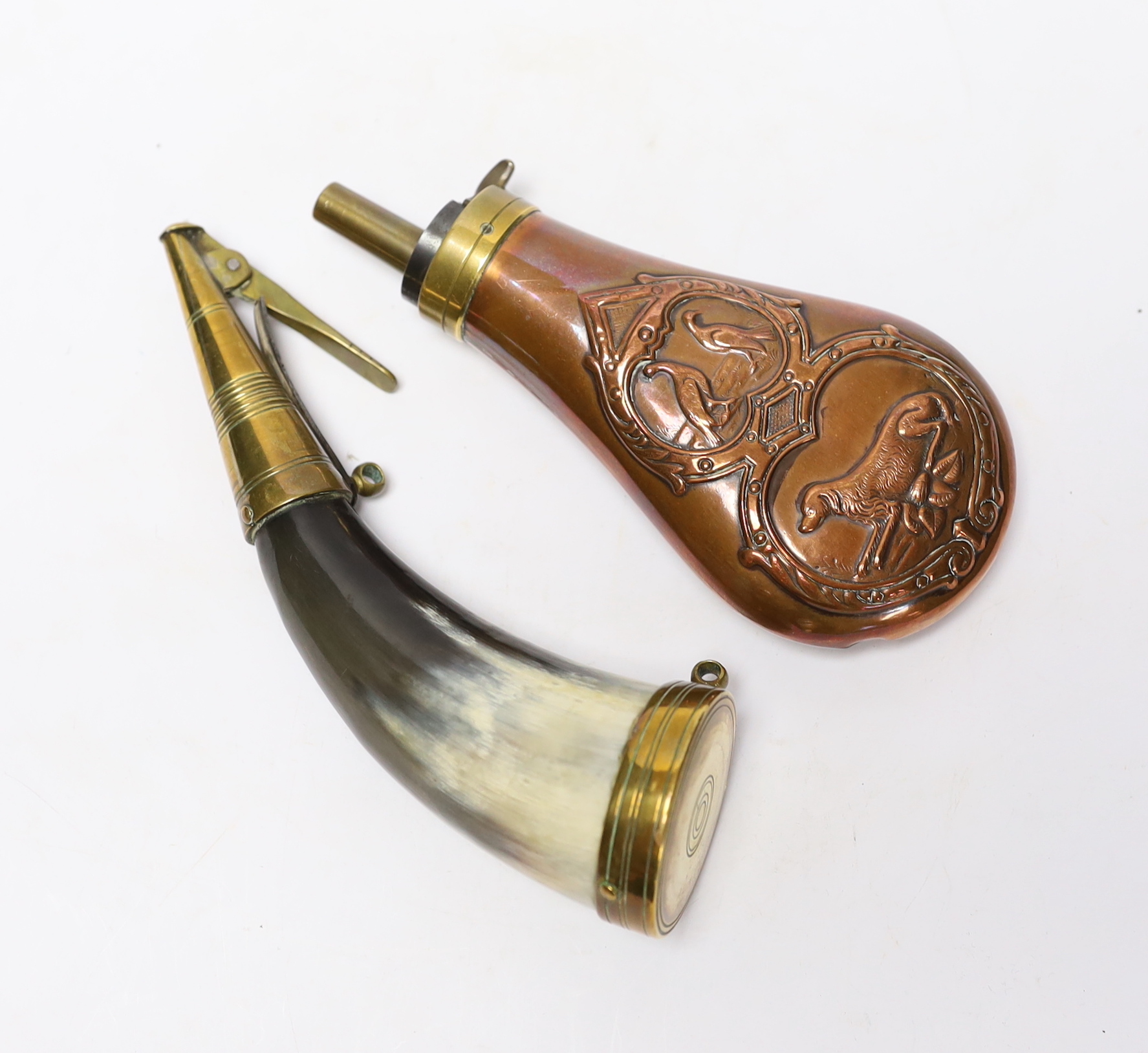A brass mounted powder horn and a copper powder flask, horn 18cm